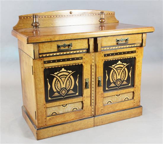 A Victorian Aesthetic Movement marquetry inlaid oak side cabinet, W.3ft 11in. D.2ft H.3ft 5in.